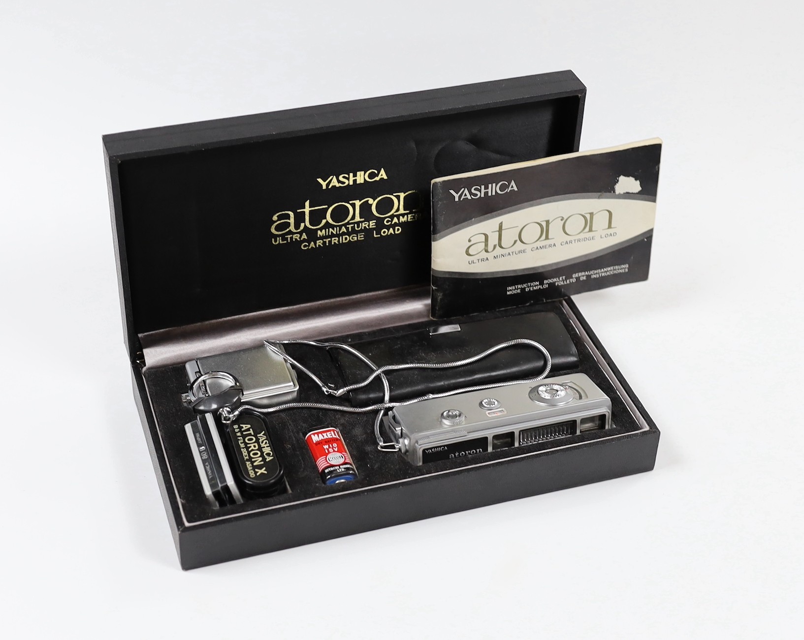 A Yashica Atoran miniature camera, with accessories in original packaging